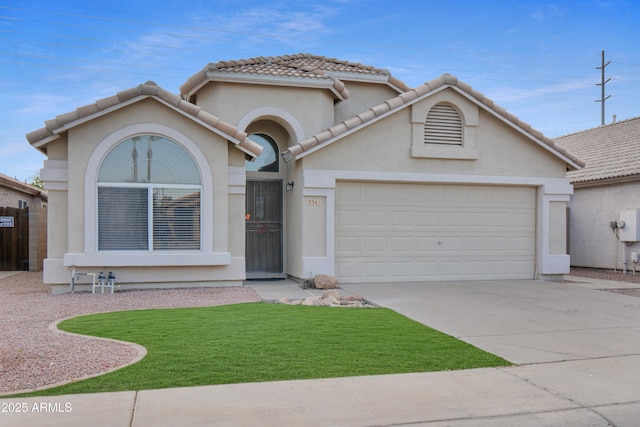 view of front facade featuring a garage and a front lawn