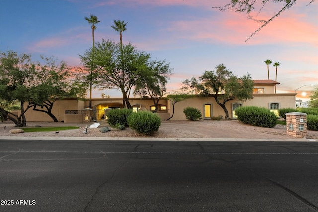 view of front of home featuring driveway and stucco siding
