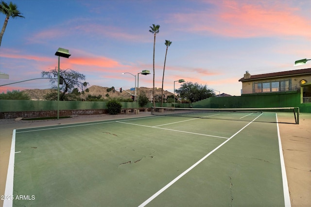 view of tennis court with fence