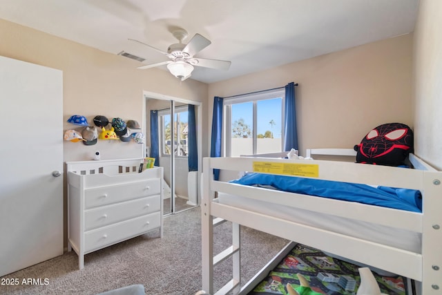 bedroom with ceiling fan and carpet