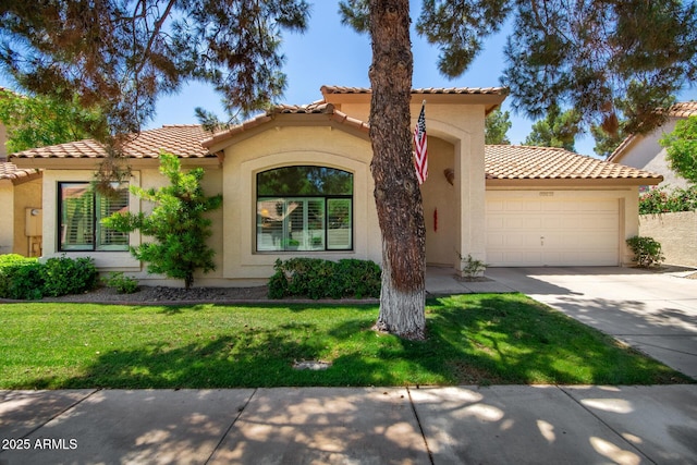 9575 S Ash Ave, Tempe, AZ 85284 - mediterranean / spanish-style house with a garage, driveway, stucco siding, a tile roof, and a front lawn