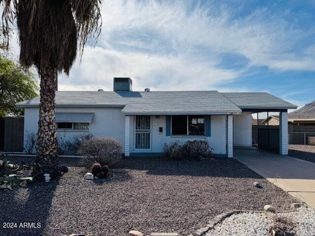 ranch-style house with a carport