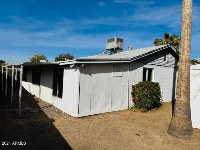 view of property exterior featuring central AC