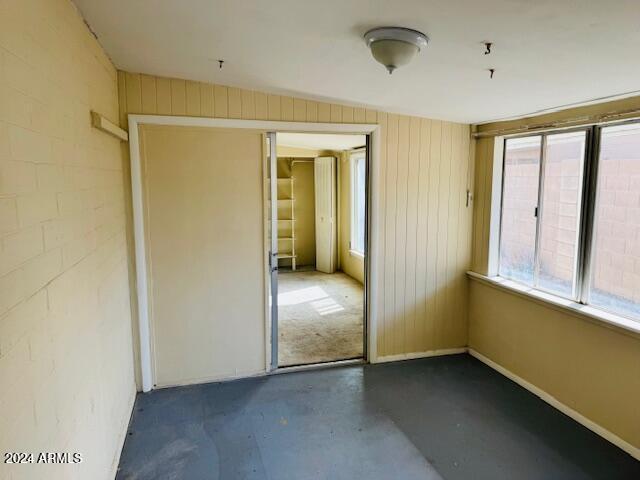 unfurnished sunroom featuring lofted ceiling