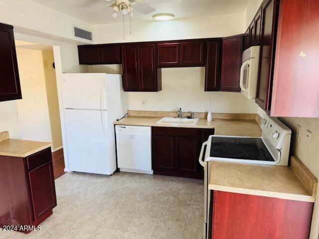 kitchen featuring ceiling fan, white appliances, and sink