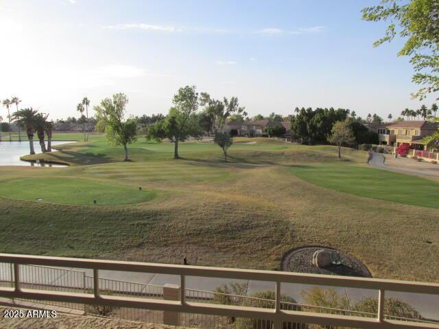 view of home's community featuring a yard and a water view