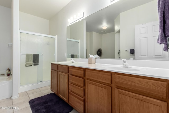 bathroom featuring vanity, tile patterned flooring, and plus walk in shower