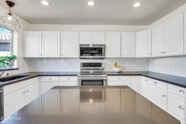 kitchen with stainless steel appliances and white cabinets