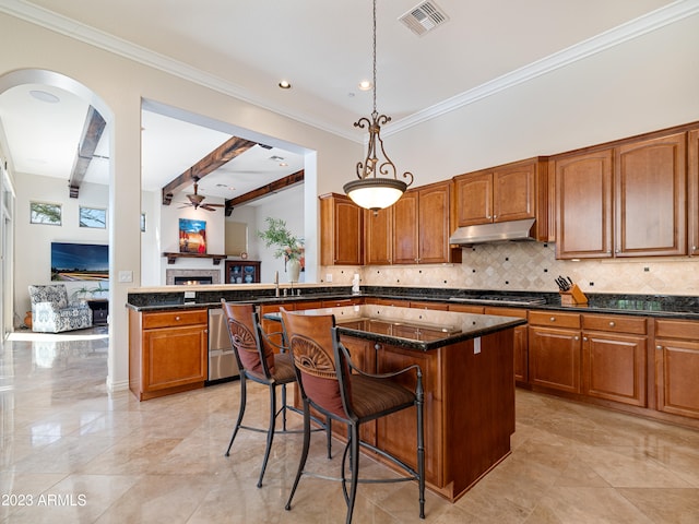 kitchen featuring visible vents, decorative backsplash, dishwasher, under cabinet range hood, and gas cooktop