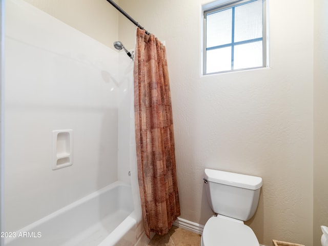 full bathroom featuring a textured wall, shower / bathtub combination with curtain, and toilet