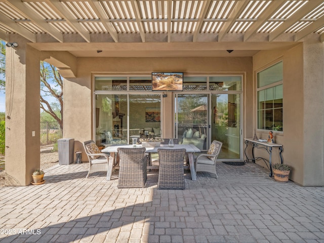 view of patio featuring a pergola and outdoor dining space