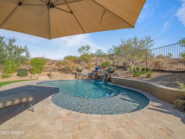 view of swimming pool with a patio, a fenced backyard, and a fenced in pool