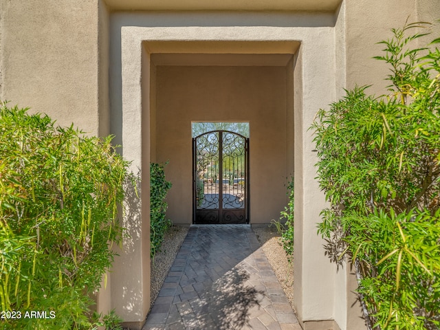 entrance to property with stucco siding