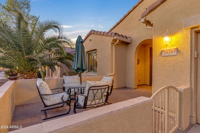 view of patio terrace at dusk