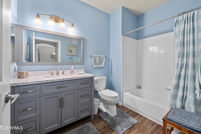 1941 S Pierpont Dr Unit 2015, Mesa, AZ 85206 - bathroom with toilet, shower / bathtub combination with curtain, vanity, and wood finished floors