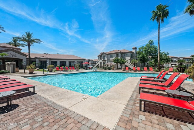 1941 S Pierpont Dr Unit 2015, Mesa, AZ 85206 - community pool with a patio, stairway, and a residential view