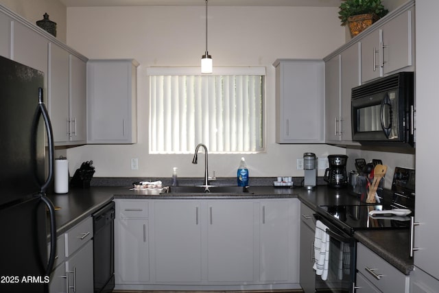 1941 S Pierpont Dr Unit 2015, Mesa, AZ 85206 - kitchen with black appliances, dark countertops, a sink, hanging light fixtures, and gray cabinets