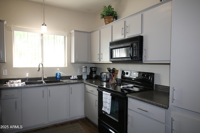 1941 S Pierpont Dr Unit 2015, Mesa, AZ 85206 - kitchen featuring black appliances, dark countertops, a sink, and decorative light fixtures