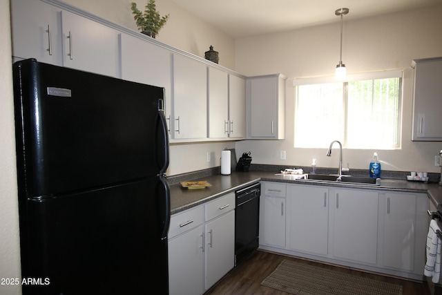 1941 S Pierpont Dr Unit 2015, Mesa, AZ 85206 - kitchen with black appliances, a sink, dark countertops, dark wood-style floors, and hanging light fixtures