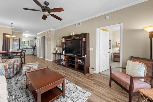 1941 S Pierpont Dr Unit 2015, Mesa, AZ 85206 - living area featuring ceiling fan, crown molding, light wood-style flooring, a chandelier, and baseboards