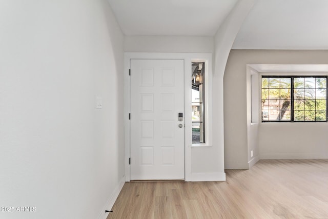 foyer entrance with light hardwood / wood-style flooring