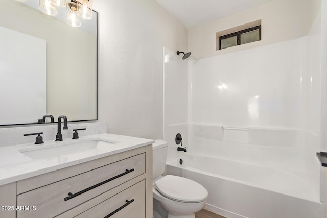 full bathroom with shower / tub combination, vanity, and toilet