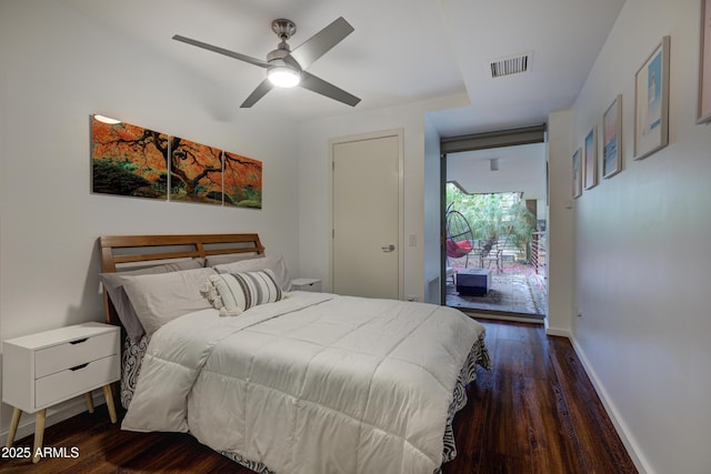 bedroom with ceiling fan and dark hardwood / wood-style flooring