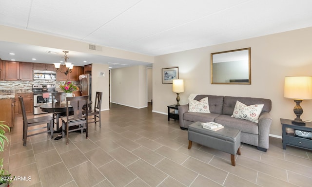 7960 E Camelback Rd Unit 409, Scottsdale, AZ 85251 - living room with a chandelier and recessed lighting
