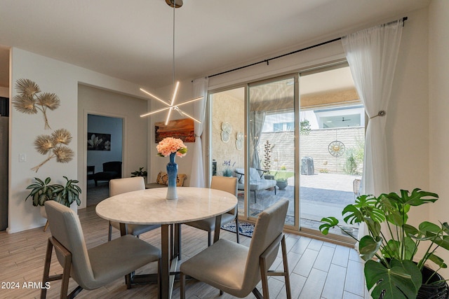 dining area with light wood-type flooring