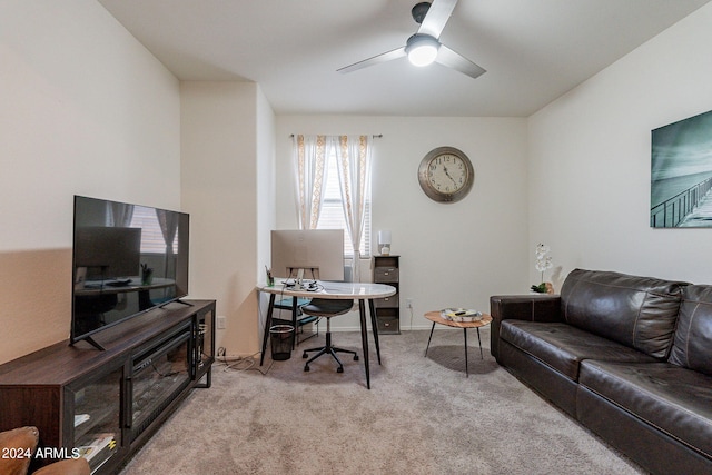 home office with carpet flooring, a ceiling fan, and baseboards