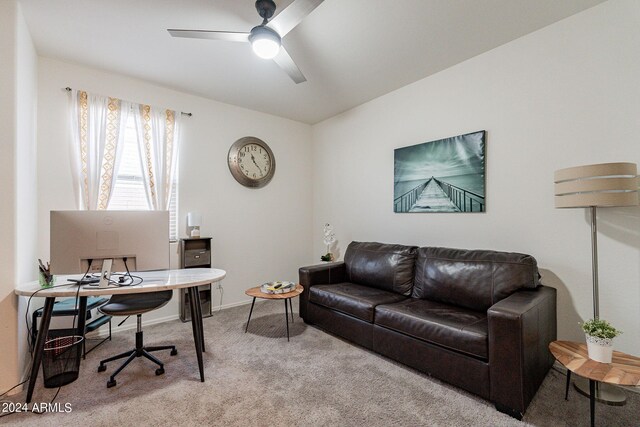 carpeted office featuring ceiling fan and baseboards