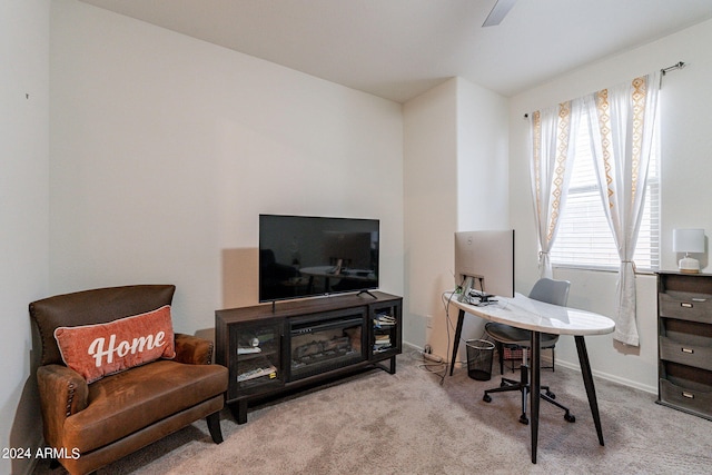 carpeted office featuring baseboards