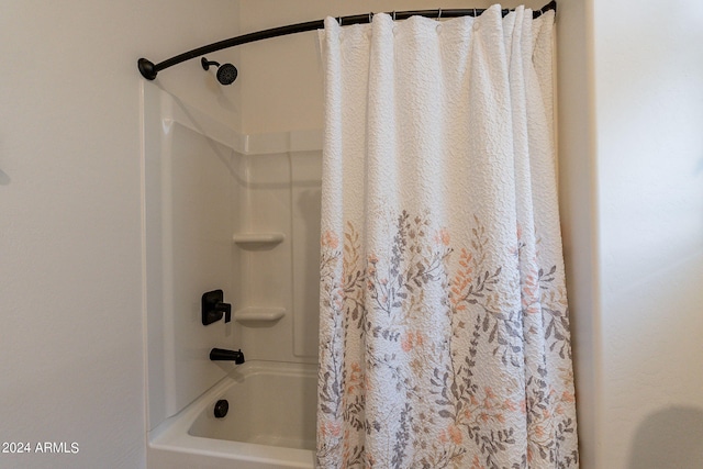 full bathroom with shower / tub combo with curtain