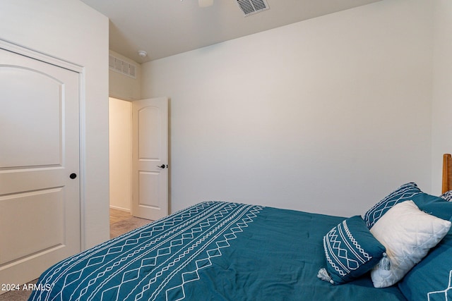 bedroom with ceiling fan and visible vents