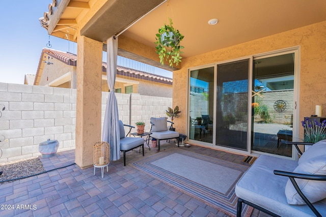 view of patio / terrace featuring fence