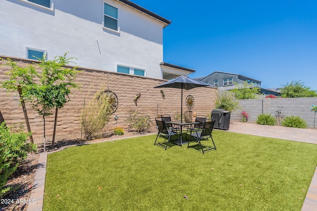 view of yard with a patio area and a fenced backyard