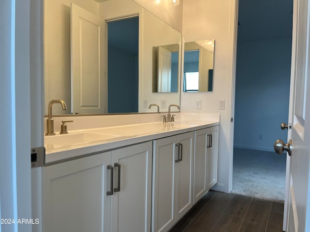 bathroom featuring hardwood / wood-style floors and vanity