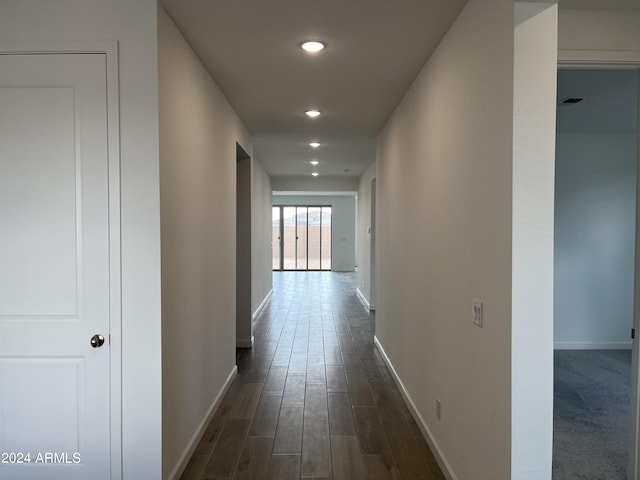 hall with dark wood-type flooring