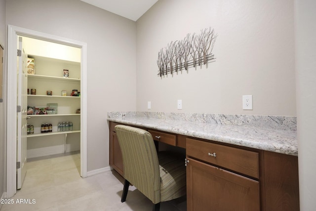 unfurnished office with built in study area