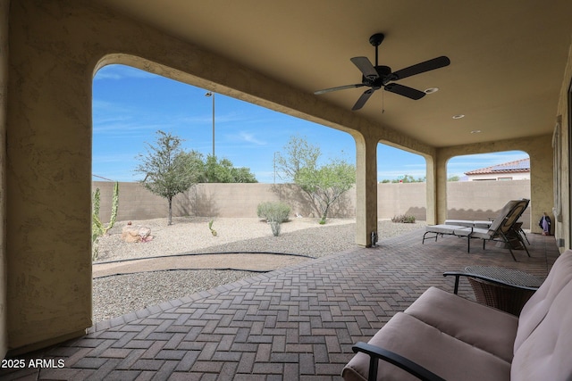 view of patio / terrace with a fenced backyard and a ceiling fan