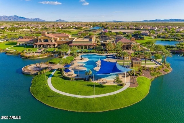 birds eye view of property featuring a water and mountain view and a residential view