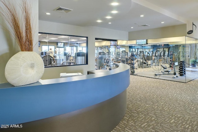 exercise room featuring carpet floors, visible vents, and recessed lighting
