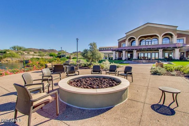 view of patio / terrace featuring a fire pit