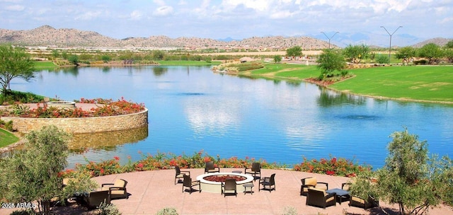 water view featuring a mountain view and an outdoor fire pit