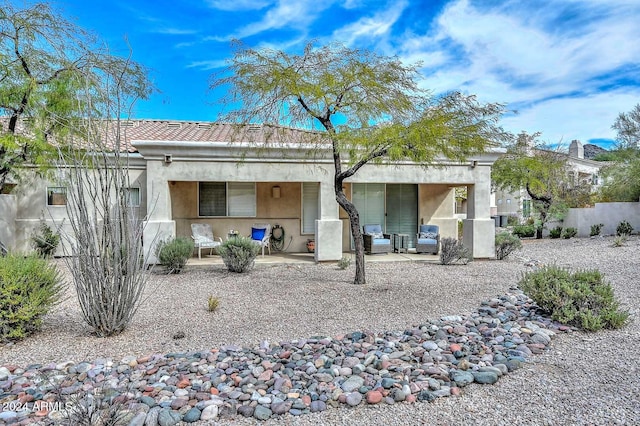 rear view of house with a patio area