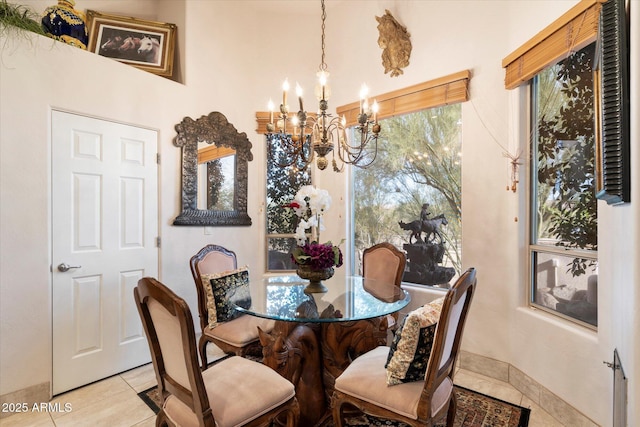 dining room featuring a notable chandelier and light tile patterned floors