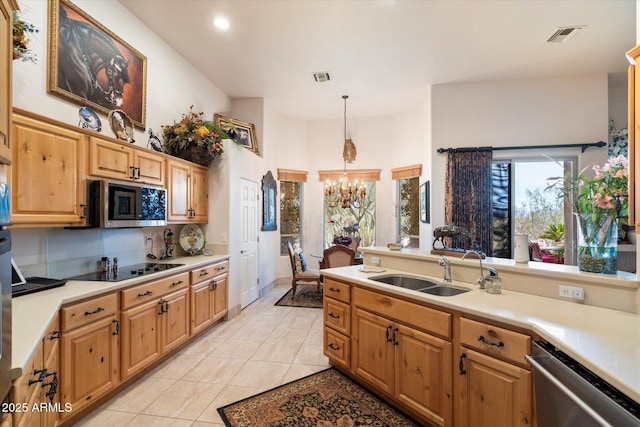 kitchen featuring pendant lighting, sink, an inviting chandelier, stainless steel appliances, and light tile patterned flooring