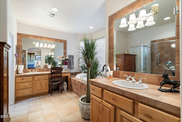 bathroom with vanity, tile patterned flooring, and walk in shower