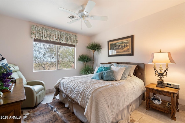 bedroom featuring tile patterned floors and ceiling fan