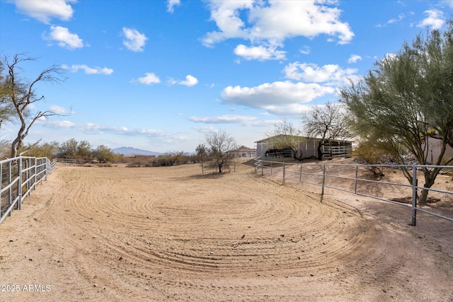 view of yard with a rural view